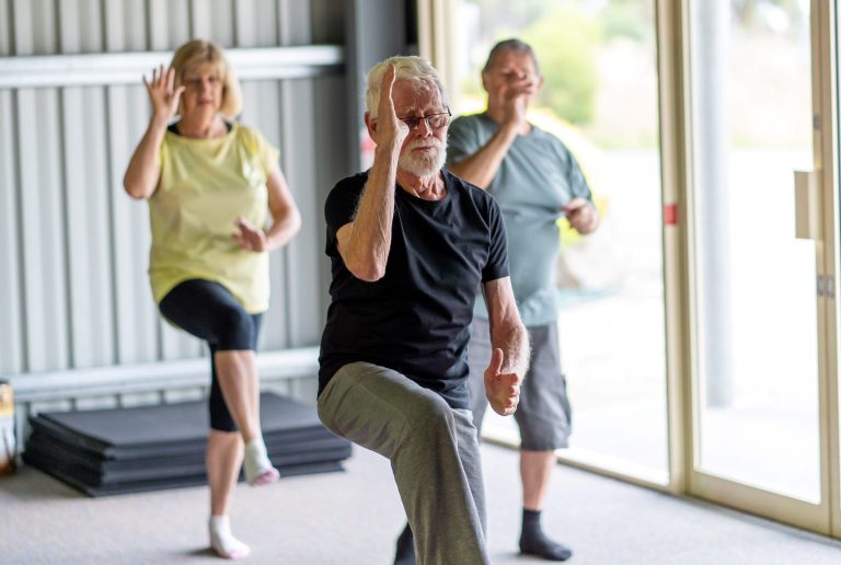 group-seniors-tai-chi-class-exercising-1950461572